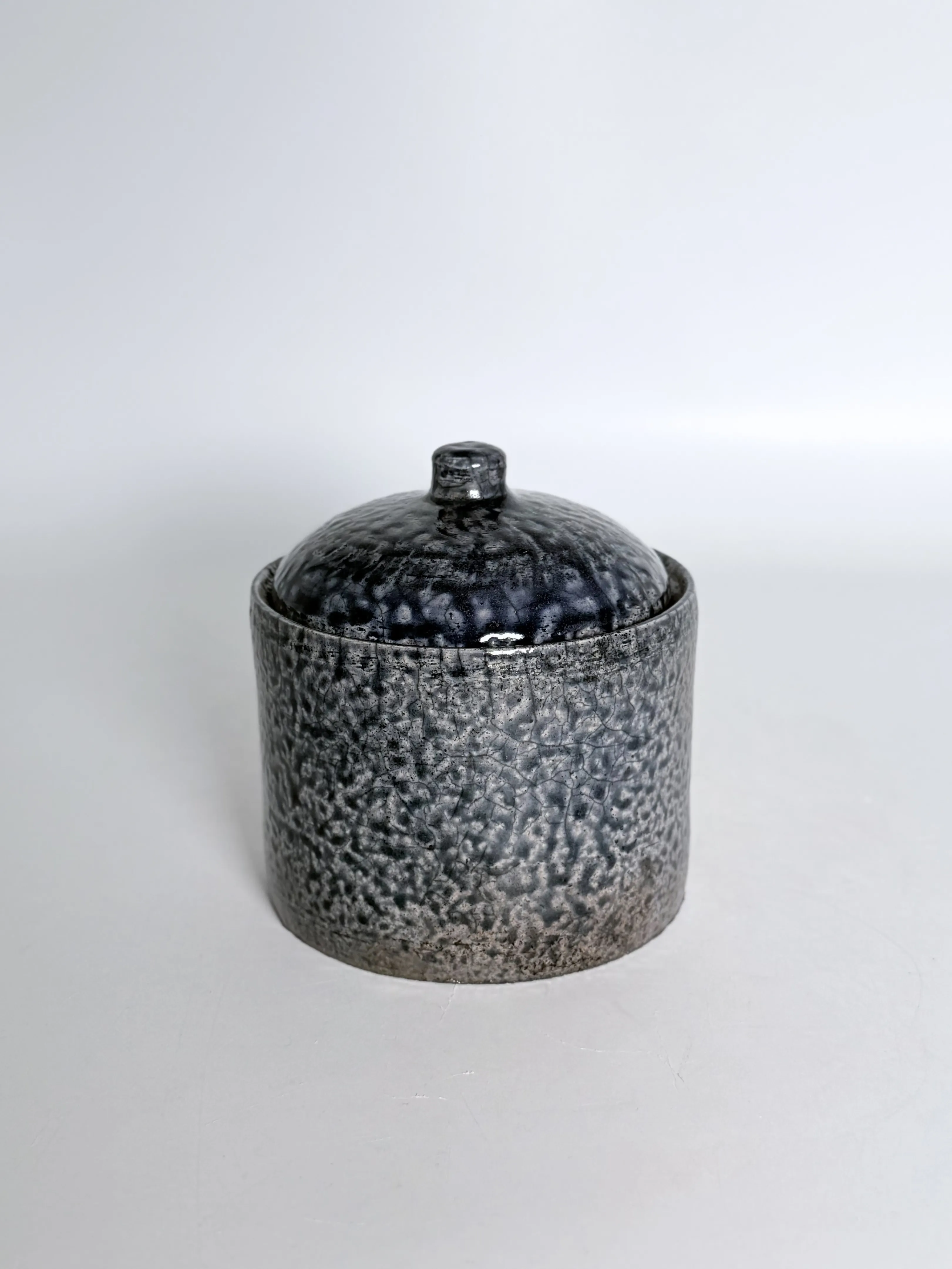 Raku Fired Lidded Jar, studio view 1